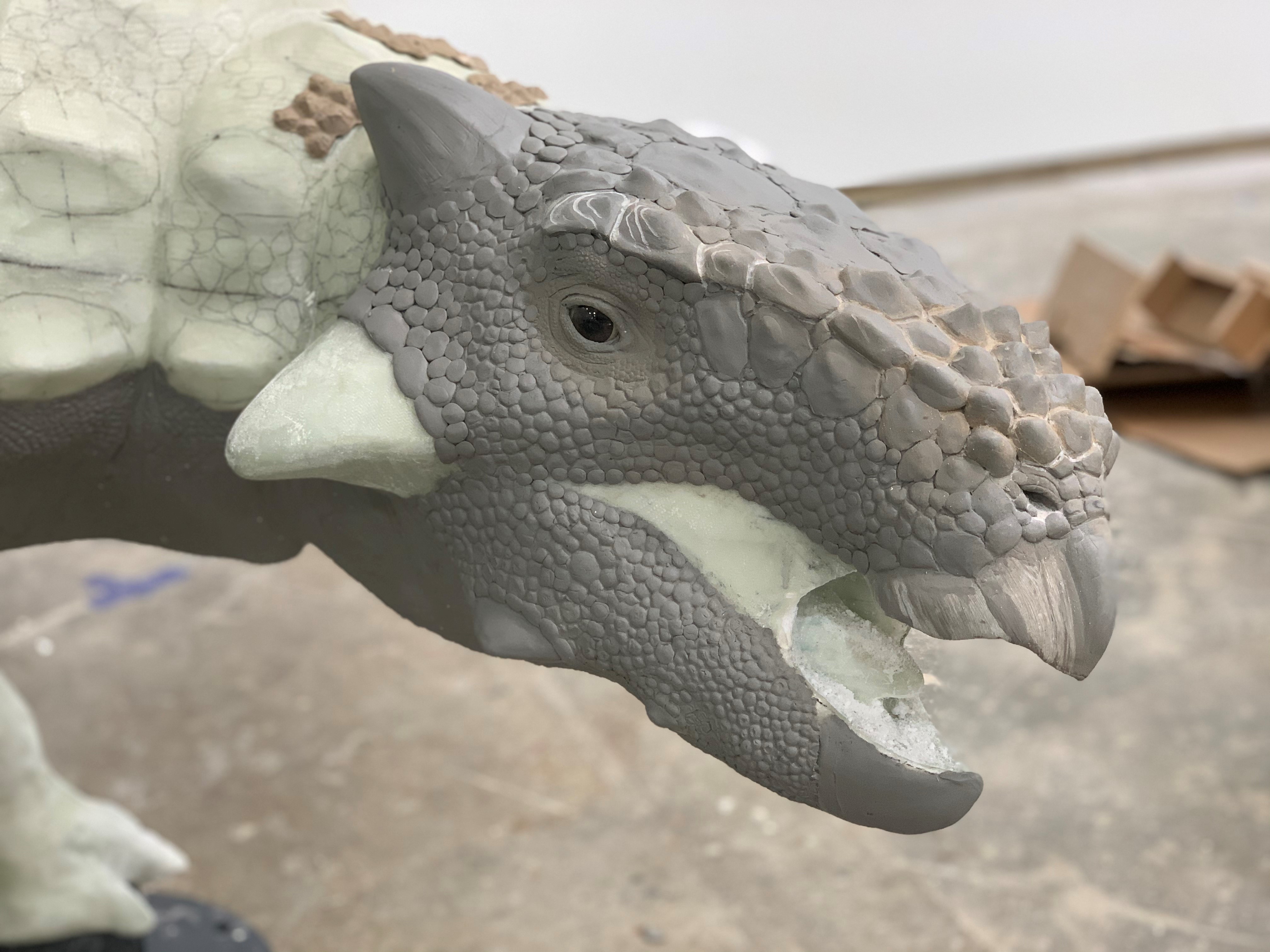 An in-progress dinosaur sculpture