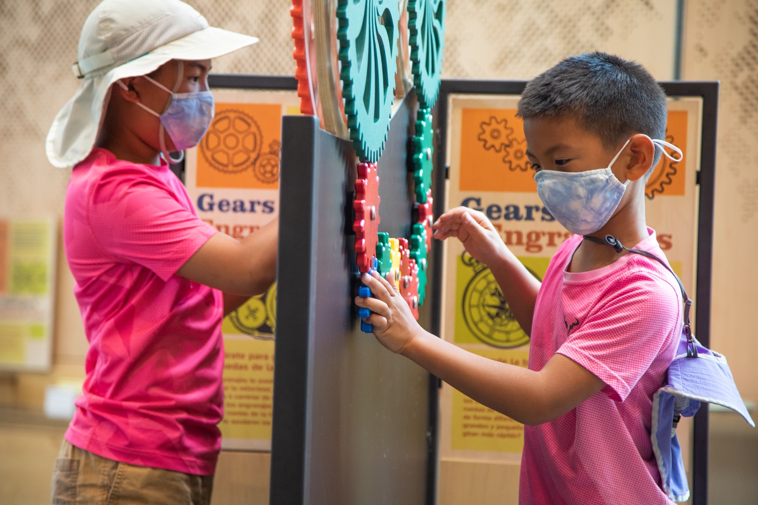 Two Children in the Museum using Gears