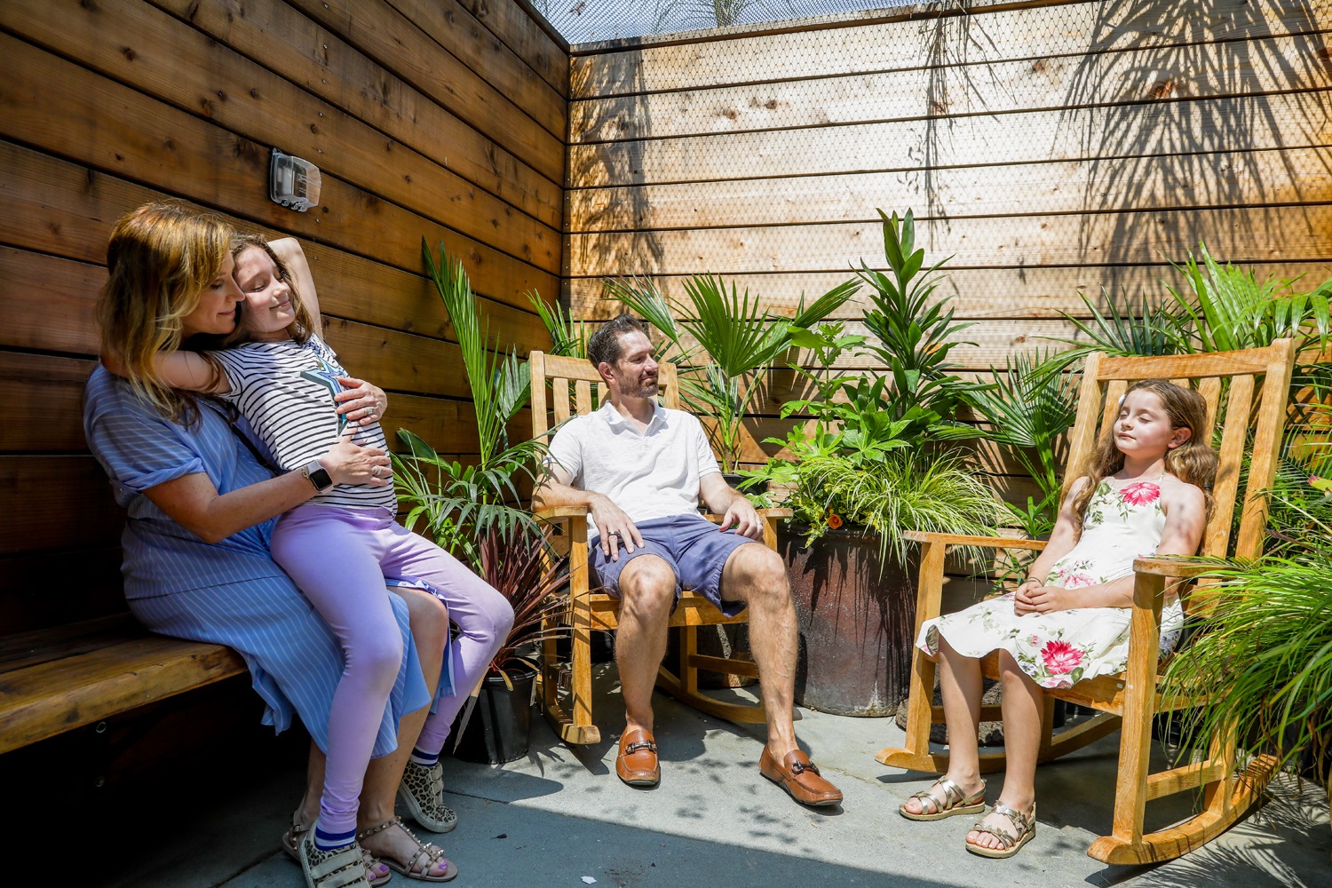 A family of four relaxes in a calming nook at the JMZ